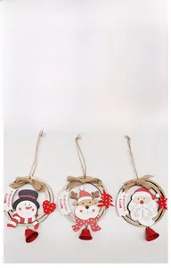 Detail of wooden Christmas ornaments featuring Santa, reindeer, and snowman designs