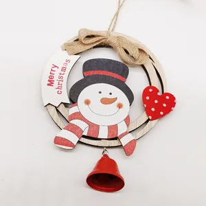 Wooden Christmas snowman ornament with Merry Christmas sign and a red metal bell decoration