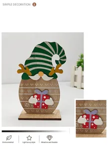 Detail of wooden Christmas gnome ornament with reindeer antlers and a gift box base