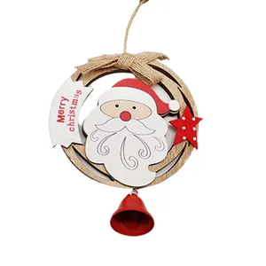 Christmas wooden ornament with Santa Claus and a red bell hanging from a jute rope