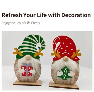 Detail of wooden Christmas gnomes with faux fur beards and festive XMAS tree decor