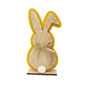 Minimalist wooden Easter bunny ornament with yellow frame and plush tail on base