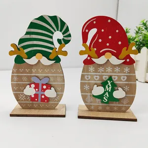 Set of two festive wooden Santa gnome ornaments with striped hats and XMAS tree