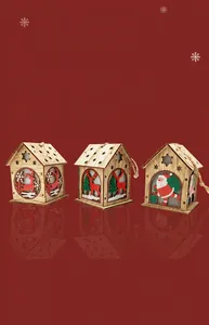 Three glowing wooden Christmas house ornaments with Santa and reindeer carvings