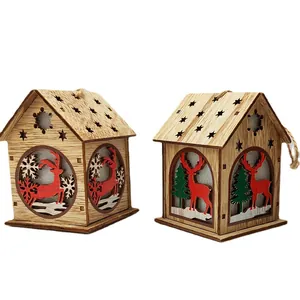 Lighted wooden Christmas house ornaments with reindeer and snowflake carvings