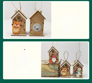Detail of wooden Christmas house ornament showing back battery compartment and LED switch