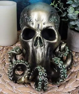 Detail of Cthulhu skull octopus resin statue with bronze texture on a woven mat