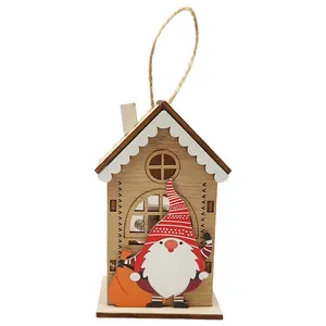 Hanging wooden Christmas house ornament with a red gnome and warm LED night light