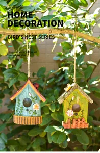 Close-up of decorative birdhouse ornaments with floral reliefs and natural jute hanging ropes