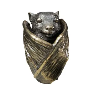 Bat-shaped jewelry storage box with gothic bronze finish and detailed wing carvings