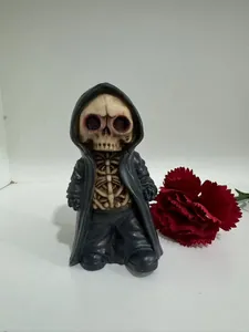 Macro view of a resin Grim Reaper skeleton figurine with a black hooded robe and aged bone texture