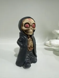 Detailed view of miniature resin Grim Reaper figurine with skull and grey cloak