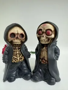Detailed close-up of resin reaper skeletons with black cloaks for Halloween decor