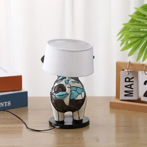 Creative resin animal lamp featuring a colorful mosaic base and white fabric drum shade