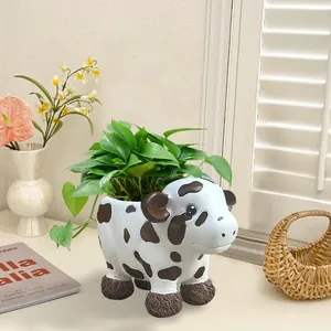 Detail of cute resin cow planter with spot patterns and fuzzy leg textures for indoor plants