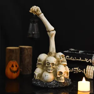 Halloween zombie skeleton hand holding a vintage resin lantern garden outdoor ornament