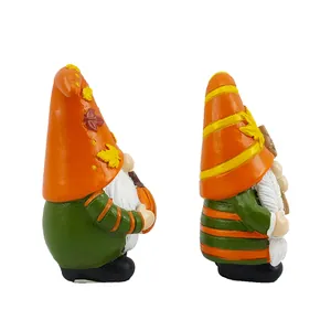 Autumn resin gnome figurines with orange maple leaf hats and pumpkins for Thanksgiving decor
