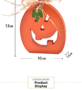 Detail view of orange wooden pumpkin ornament showing 13cm height and 10cm width dimensions