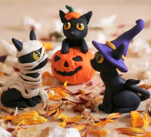 Detailed trio of Halloween resin black cats: mummy cat, pumpkin cat, and witch cat figurines