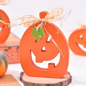 Halloween orange wooden pumpkin ornament with raffia bow and rustic wood base