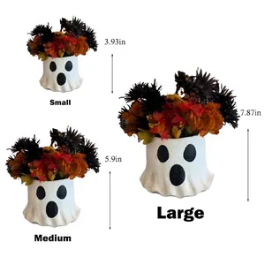 Three assorted Halloween paper mache ghost treat buckets in small, medium, and large sizes