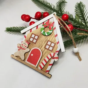 Wooden gingerbread house Christmas ornament with hanging rope and red festive details