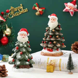 Christmas tree figurines with Santa face design and red baubles for festive tabletop decor