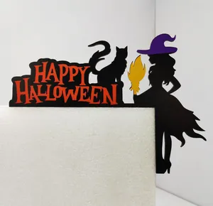 Detail of Halloween door frame decor with witch silhouette and Happy Halloween text
