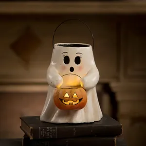 Ghost figurine holding a glowing pumpkin lantern for Halloween tabletop decoration