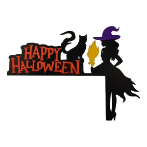 Detail of wooden Halloween door corner decor featuring a witch silhouette and black cat