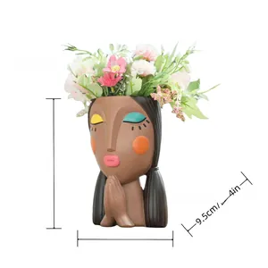 Detailed dimensions of a female resin planter showing 15cm height and floral headpiece