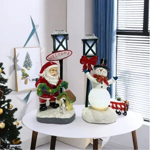Close-up of LED glowing Santa Claus resin ornament with welcome sign and cozy dog house detail