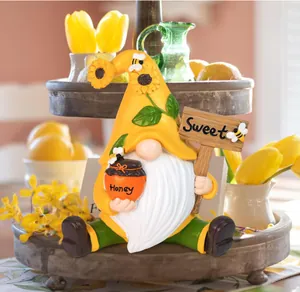 Garden gnome holding honey jar and sweet sign on a rustic wooden decorative tiered tray