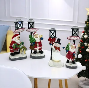 Detailed resin Christmas figurines set with Santa, snowman and lighted Welcome sign post