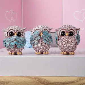 Three-piece set of resin owl figurines in See No Evil, Hear No Evil, Speak No Evil poses