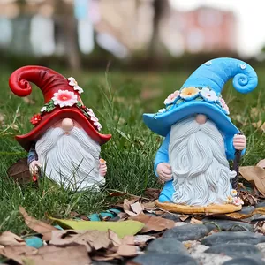 Detailed view of two garden gnomes with floral hats and intricate white beard textures