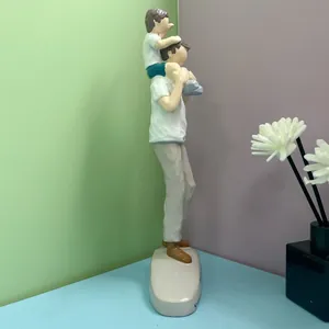 Detailed view of resin parent-child sculpture with matte finish for home decor