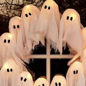 Halloween ghost wreath with warm LED lights and white textured fabric for window decoration