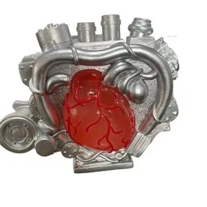Mechanical heart engine ornament with red resin heart and silver steampunk industrial details