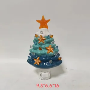 Detailed view of ocean-themed resin starfish Christmas tree night light with plug base