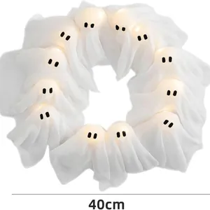 40cm Halloween wreath with ten lit white fabric ghosts and warm LED glowing lights