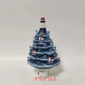 Detail of blue resin starfish LED tree night light with sailboat ornaments and a plug
