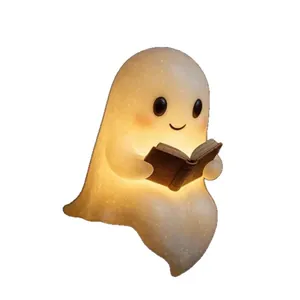 Veilleuse LED fantôme lisant un livre avec lumière chaude et texture givrée