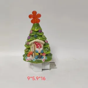 Detail of a green ceramic LED Christmas tree with a gnome and dimensions 9x5.9x16cm