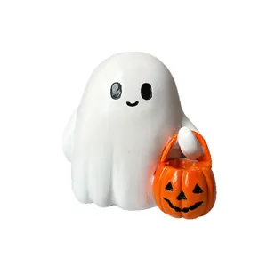Cute white ghost figurine holding a pumpkin basket for Halloween home table decor