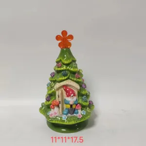 Detail of a ceramic green Christmas tree with a gnome and dimensions 11x11x17.5 cm
