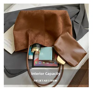 Interior view showing internal capacity of large brown tote bag with zipper pouch