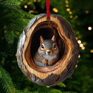 Detailed view of squirrel sitting in tree hollow ornament with festive red ribbon hanger