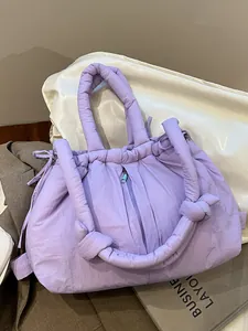 Minimalist lavender quilted puffer tote bag with puffy handles and zipper closure