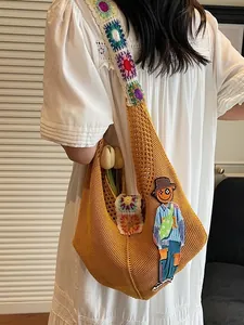 Handmade yellow knit tote bag with cartoon patch and floral crochet straps for beach